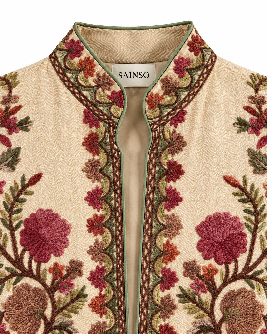 Abrigo beige con bordado marrón, verde y rosa